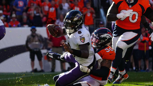 Denver Broncos safety Caden Sterns (30) sacks Baltimore Ravens quarterback Lamar Jackson (8) in the third quarter at Empower Field at Mile High.